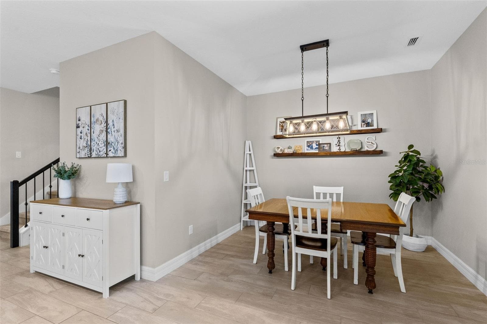 Dining area with updated custom lighting - 1274 SILO DR, ST CLOUD