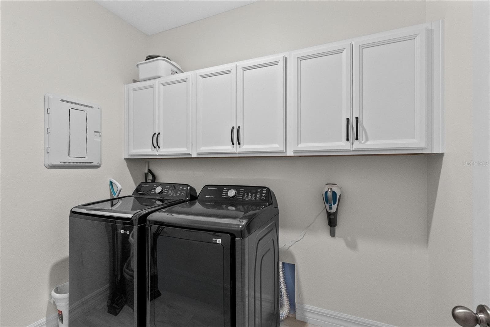 Laundry room features built in upper cabinets. Located on 1st floor - 1274 SILO DR, ST CLOUD