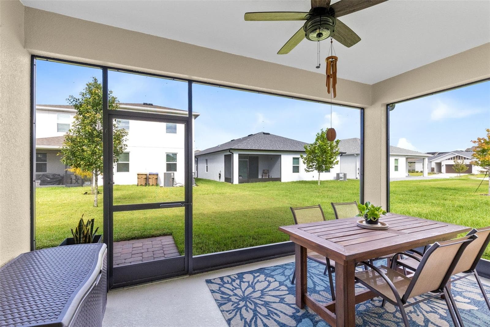 Screen enclosed, covered back patio with ceiling fan - 1274 SILO DR, ST CLOUD