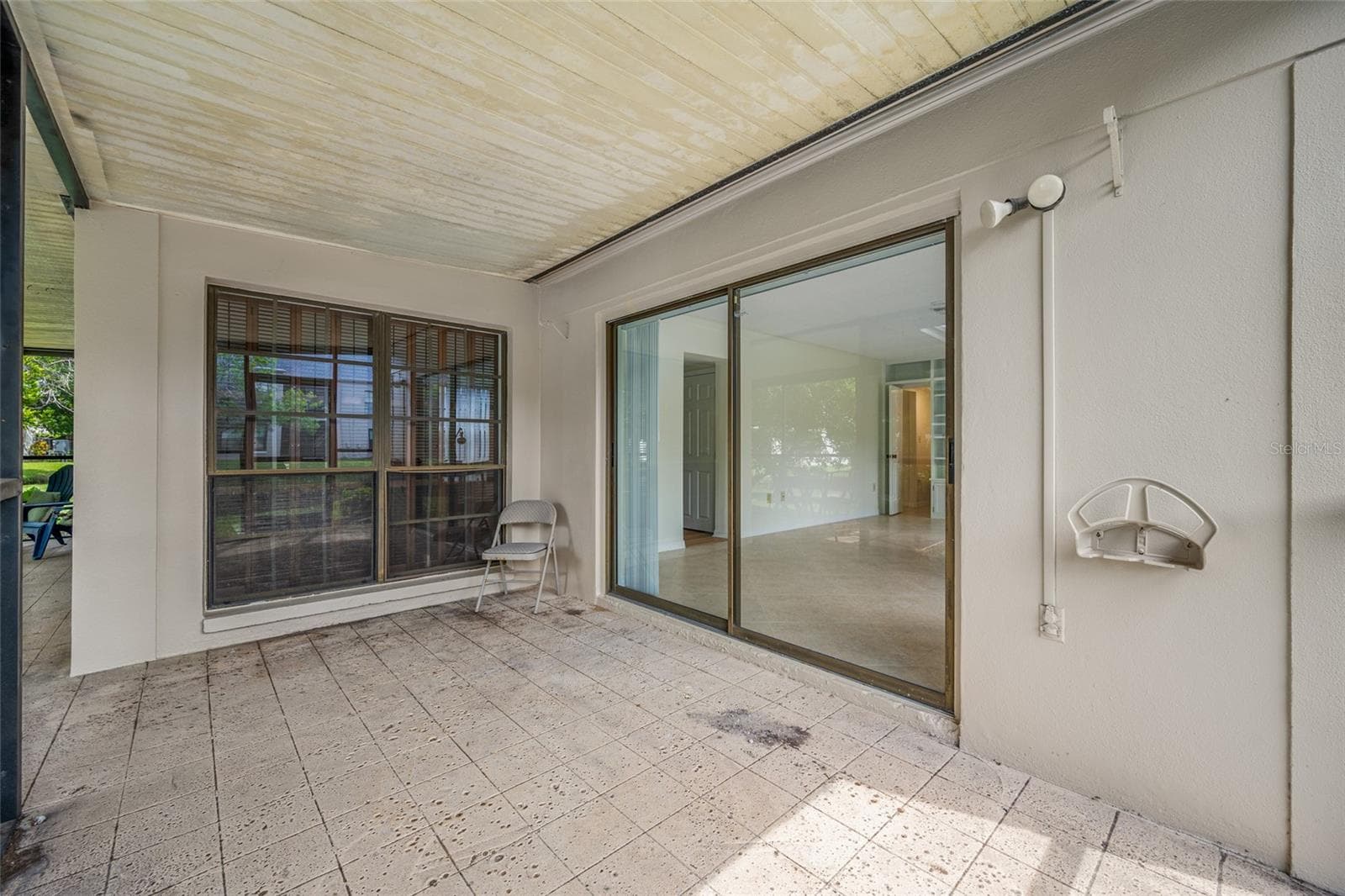 Porch attached to primary bedroom - 2467 KINGFISHER LN #101H, CLEARWATER