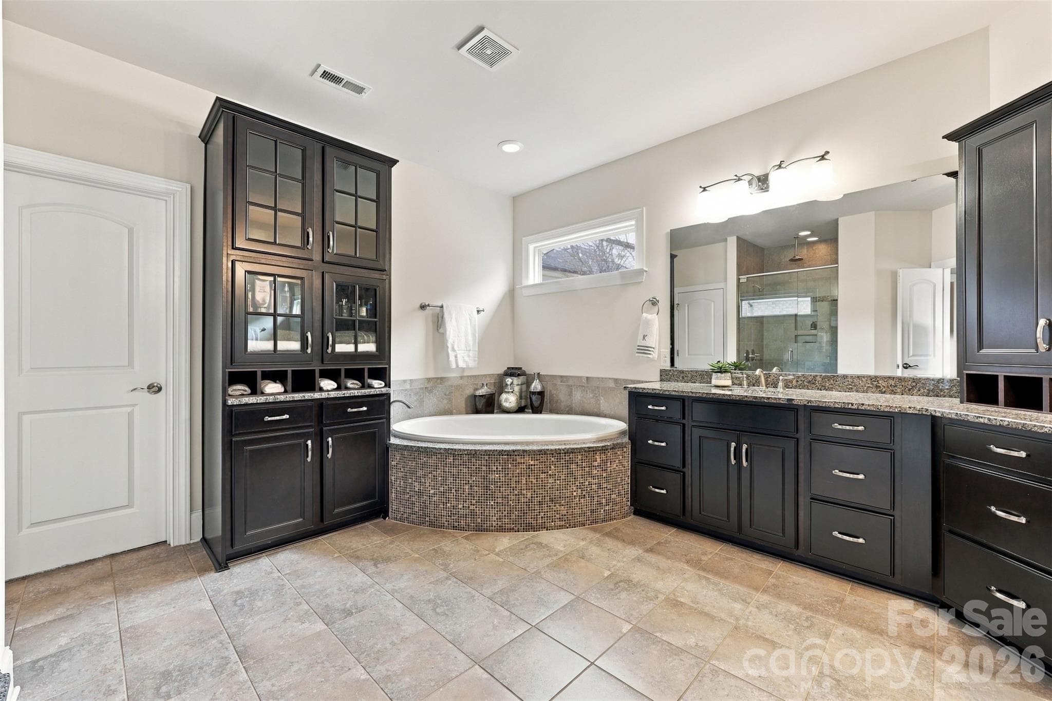 primary bathroom, his and hers sinks, ample cabinet space, garden tub, walk in shower - 131 Reserve Lane, Indian Land