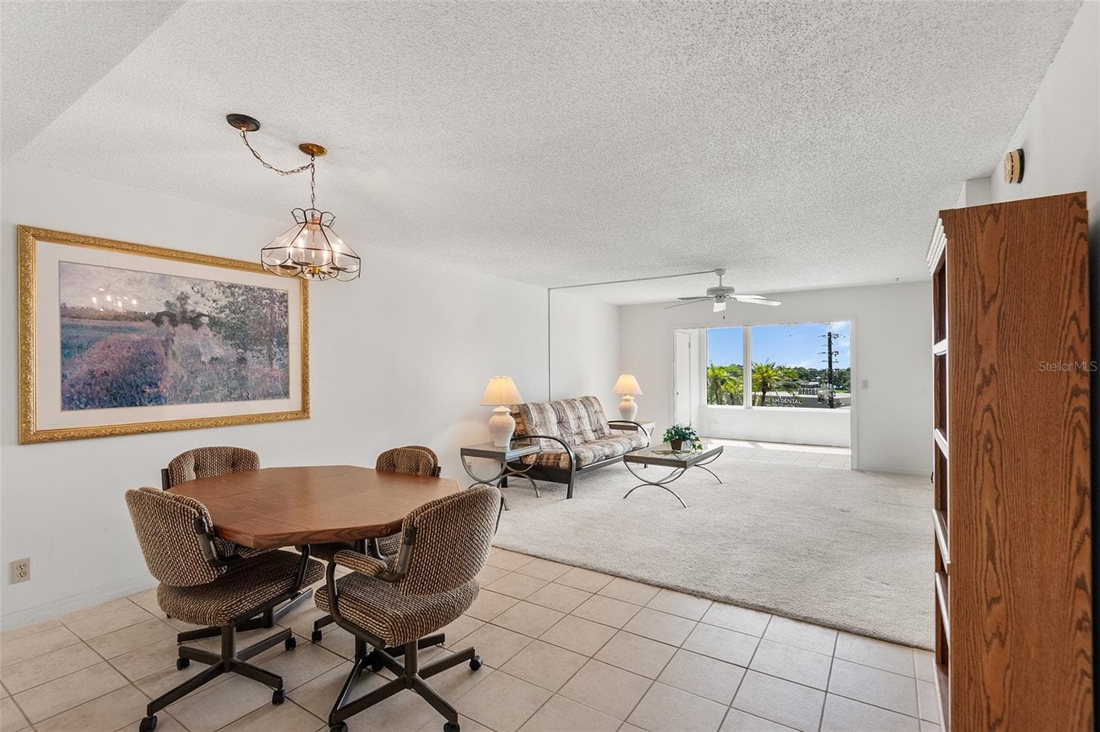 DINING AREA . VIEW TOWARDS LIVING ROOM AND BONUS ROOM - 1776 6TH ST NW #304, WINTER HAVEN