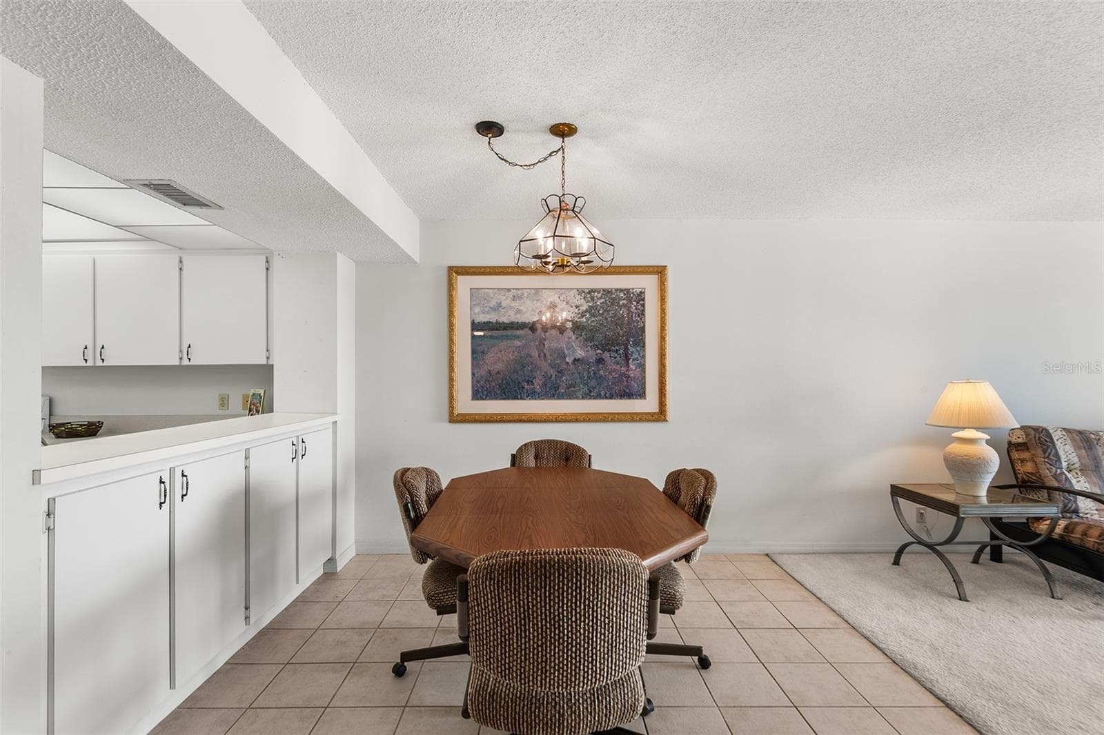DINING AREA. PASS TRU FROM KITCHEN TO LEFT. - 1776 6TH ST NW #304, WINTER HAVEN
