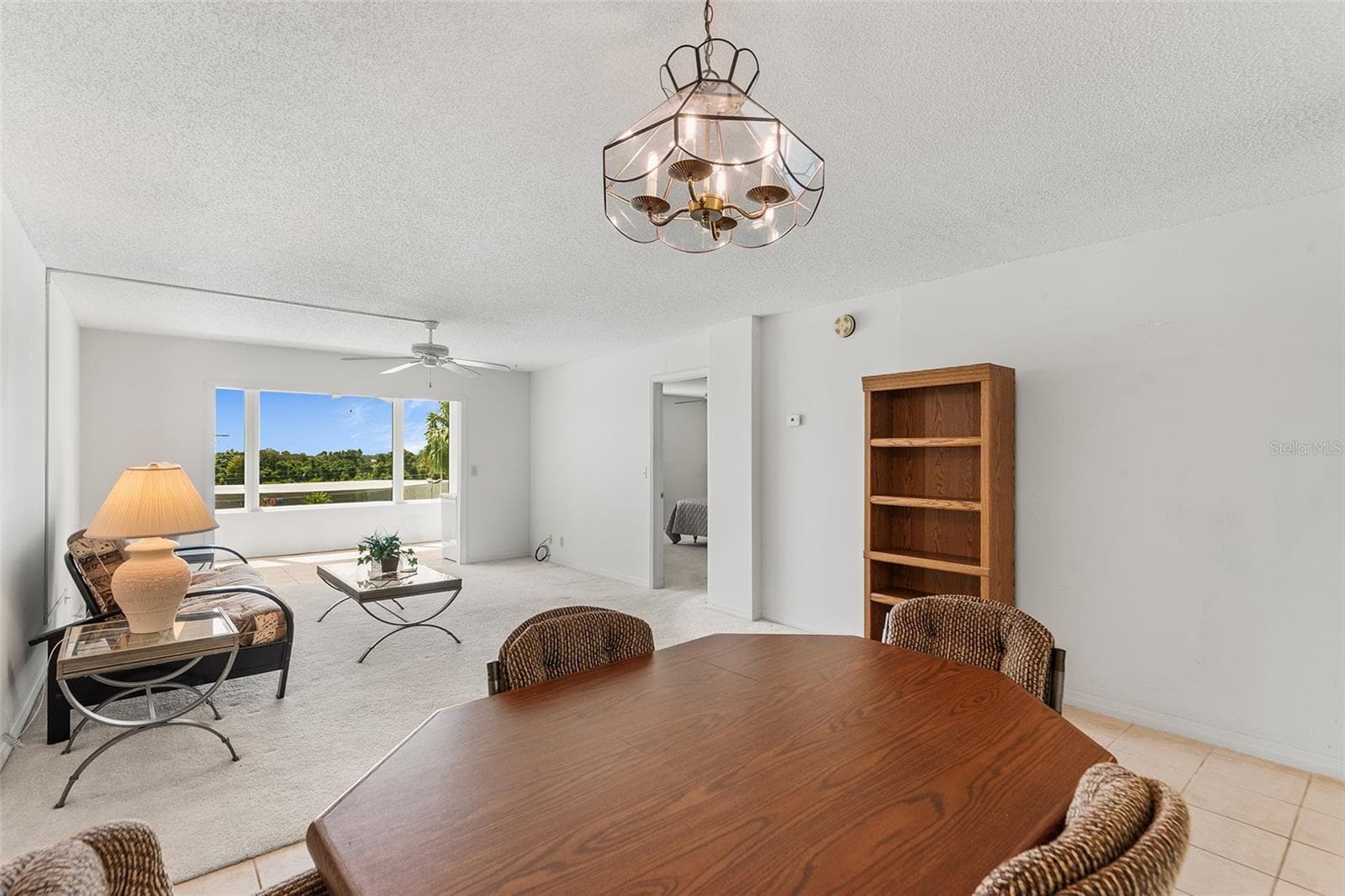 DINING AND LIVING ROOM AREA. BONUS ROOM BEYOND - 1776 6TH ST NW #304, WINTER HAVEN