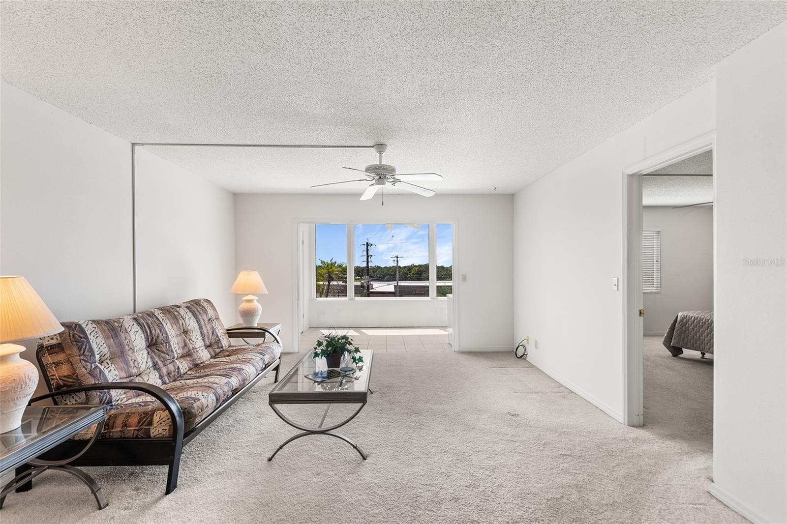 LIVING ROOM. PRIMARY BEDROOM TO THE RIGHT - 1776 6TH ST NW #304, WINTER HAVEN