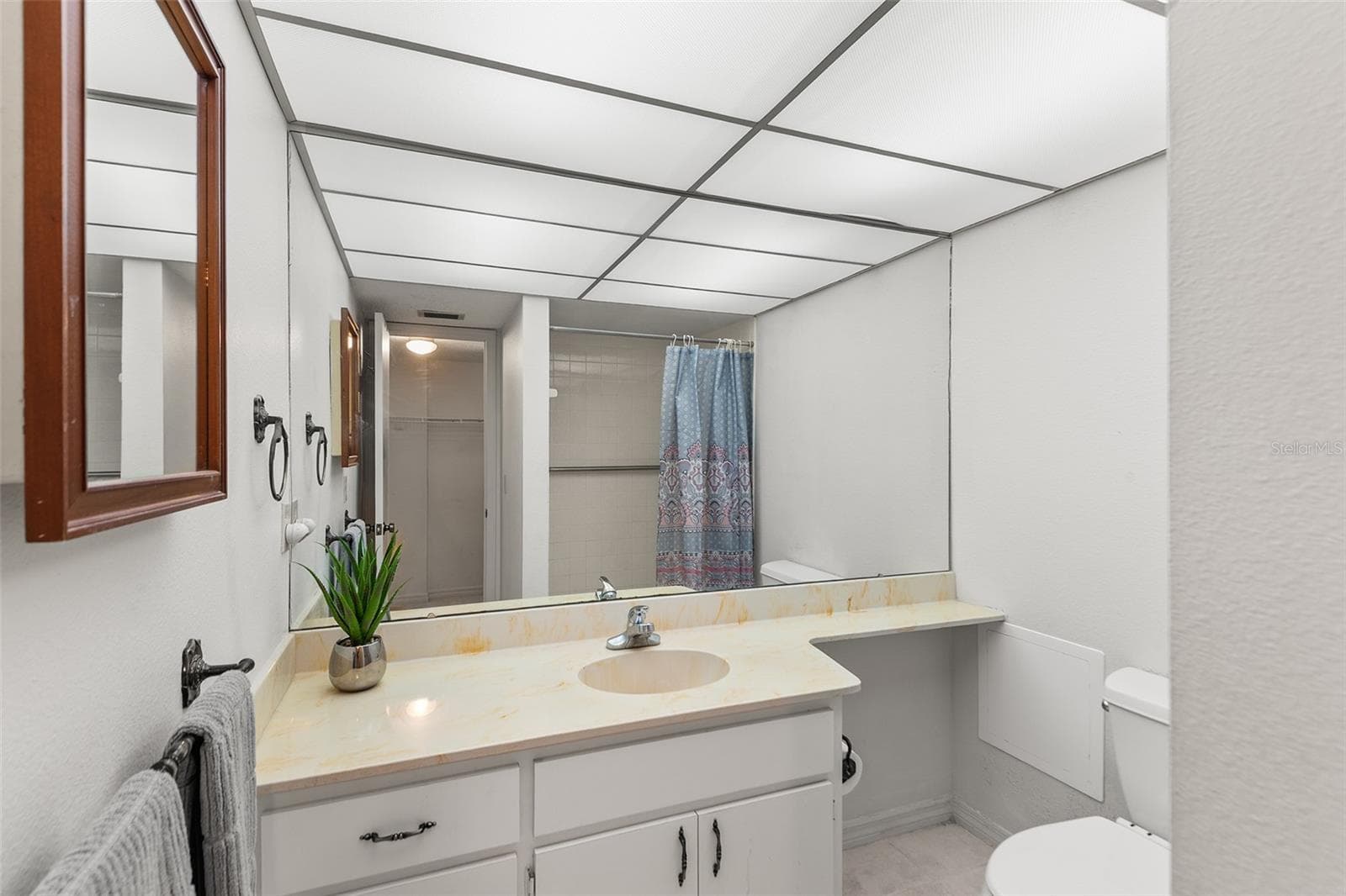 PRIMARY BATHROOM. REFLECTION OF SHOWER IN MIRROR! - 1776 6TH ST NW #304, WINTER HAVEN