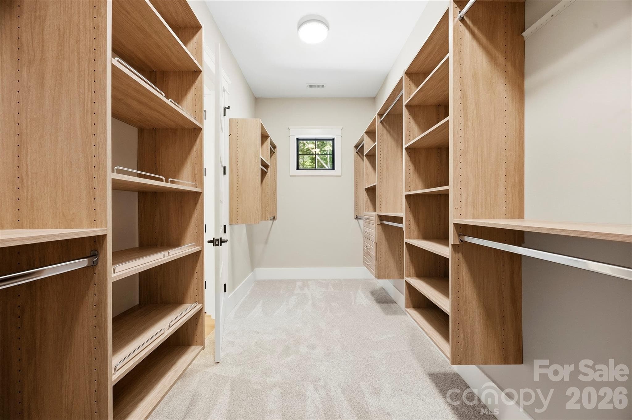 Primary walk in closet with built in shelving. - 3515 Capricorn Road, Lancaster