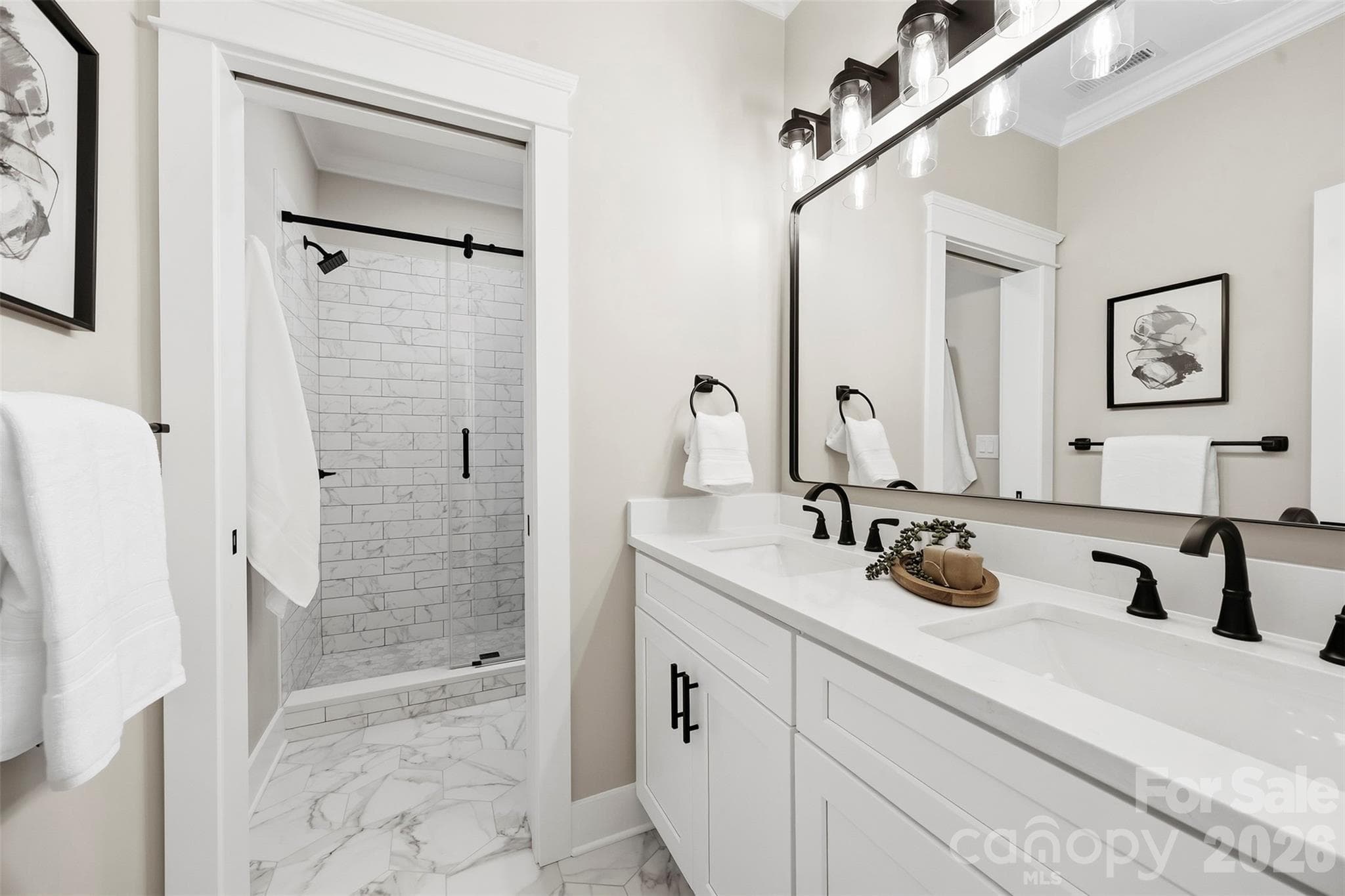 Upper bathroom with double sinks. Shower and toilet are separated by a pocket door. - 3515 Capricorn Road, Lancaster