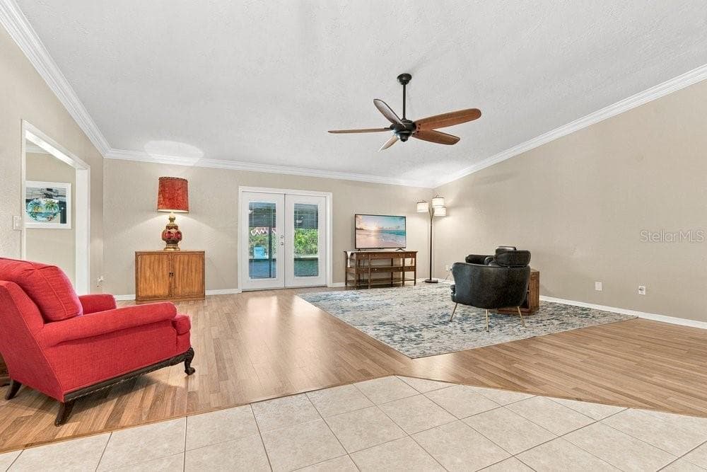 Family Room with French Doors to Patio and Pool - 3742 SUTTERS MILL CIR, CASSELBERRY