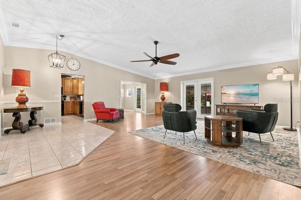 Family Room with French Doors to Patio and Pool - 3742 SUTTERS MILL CIR, CASSELBERRY