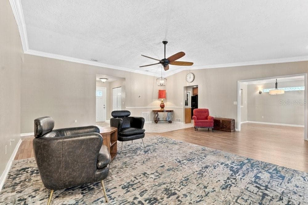 Family Room with French Doors to Patio and Pool - 3742 SUTTERS MILL CIR, CASSELBERRY