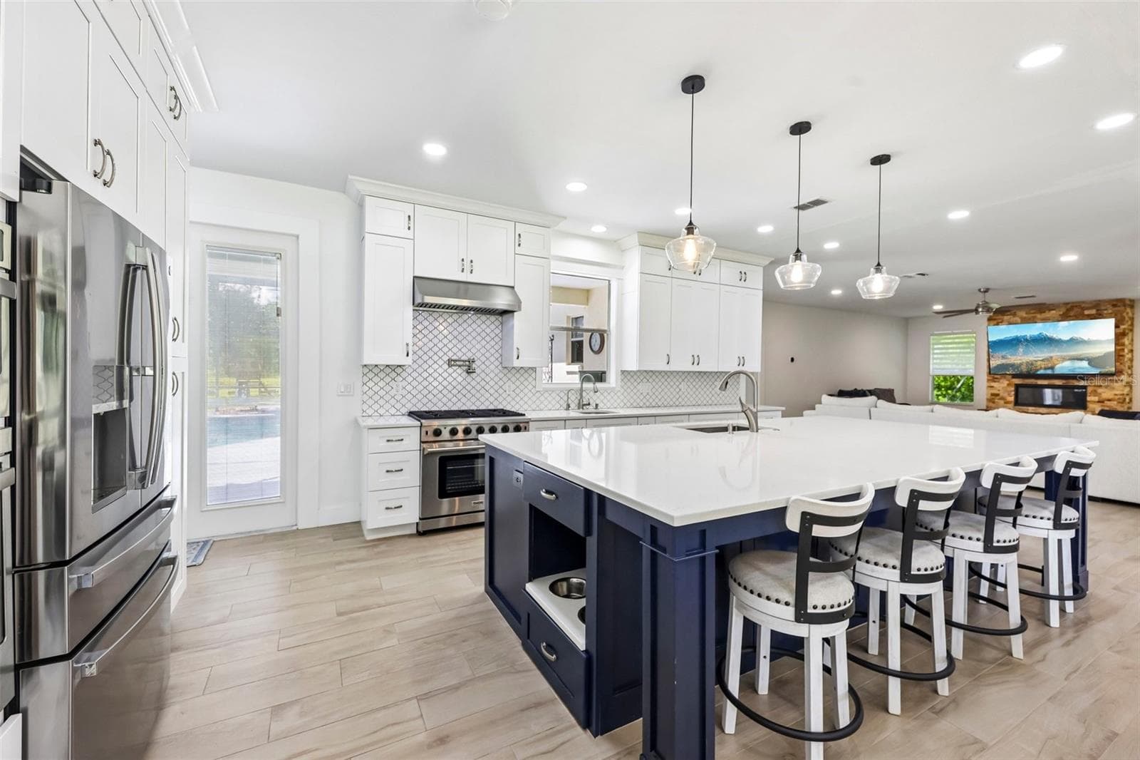 The OPEN FLOOR PLAN brings the Kitchen, Dining Room and Living Room together, creating an inviting space for everyday living and entertaining. - 19106 SHELDON ST, ORLANDO