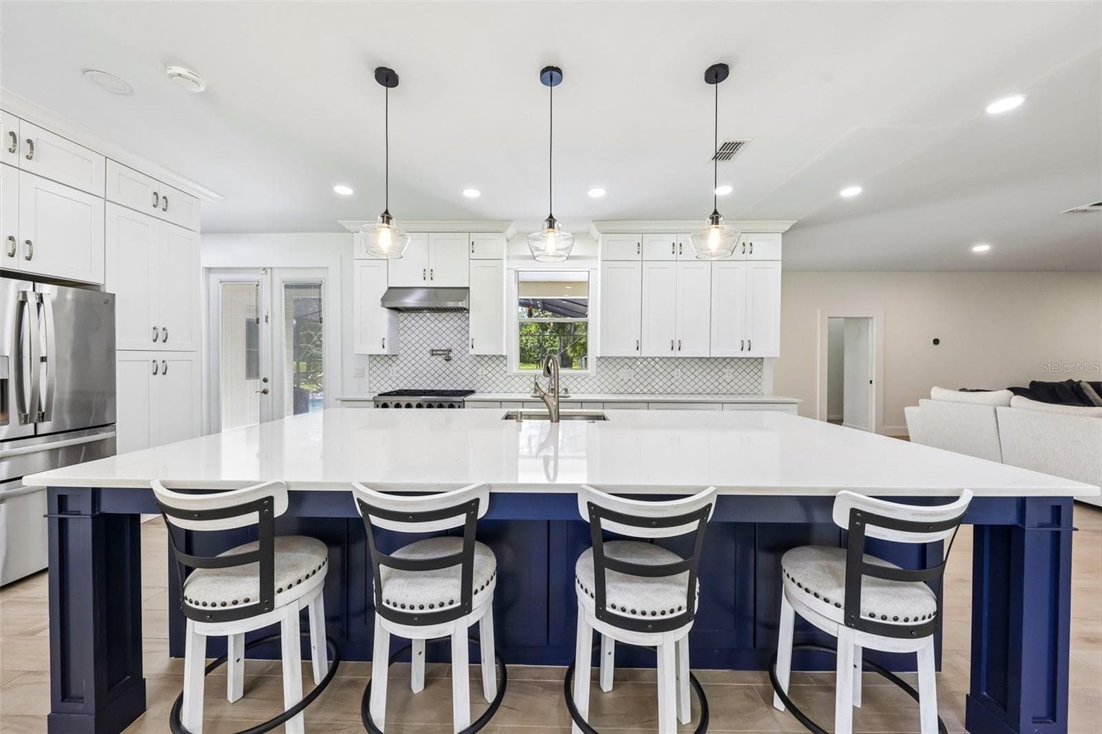 With room for counter-height stools, the center island doubles as a spot for quick meals or gathering with guests. - 19106 SHELDON ST, ORLANDO