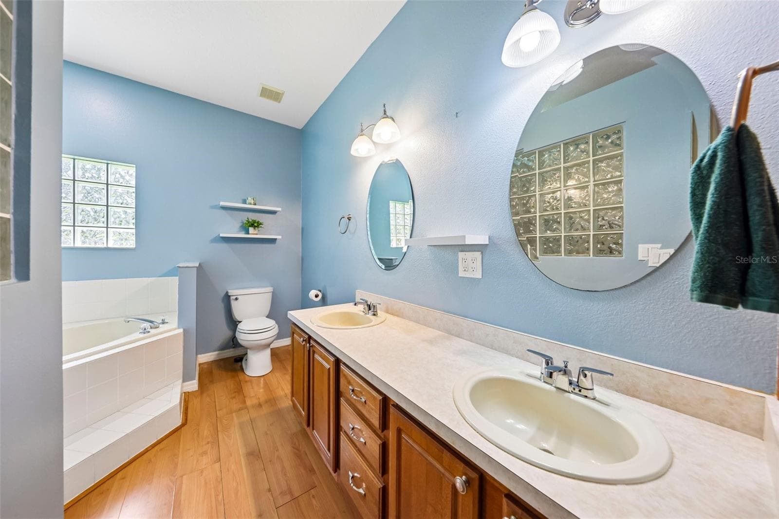 Enjoy dual sinks, a GARDEN TUB and a generous STEP-IN SHOWER in the Primary en suite Bath. - 19106 SHELDON ST, ORLANDO