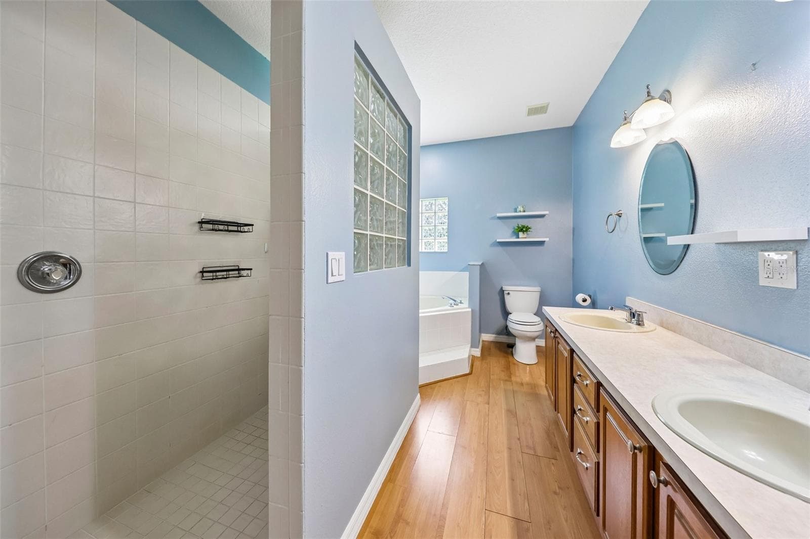 The generous step-in shower in the Primary en suite Bath. - 19106 SHELDON ST, ORLANDO