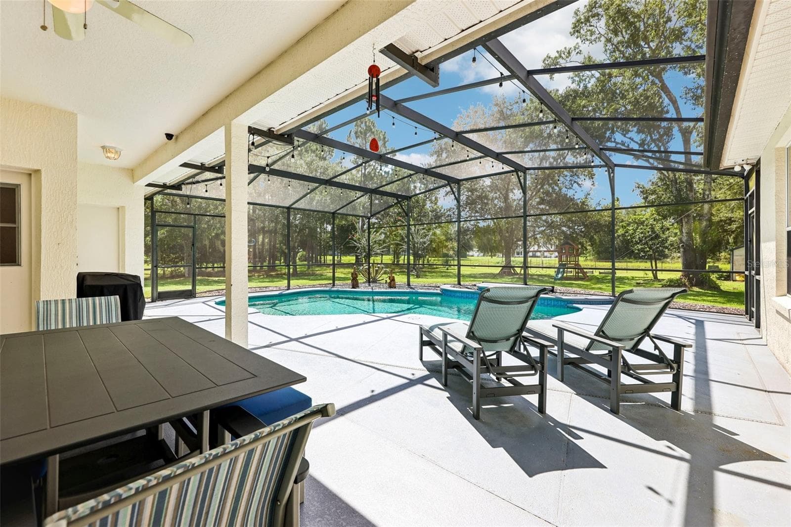 Your PRIVATE OUTDOOR RETREAT overlooks the expansive FENCED YARD and surrounding trees. - 19106 SHELDON ST, ORLANDO