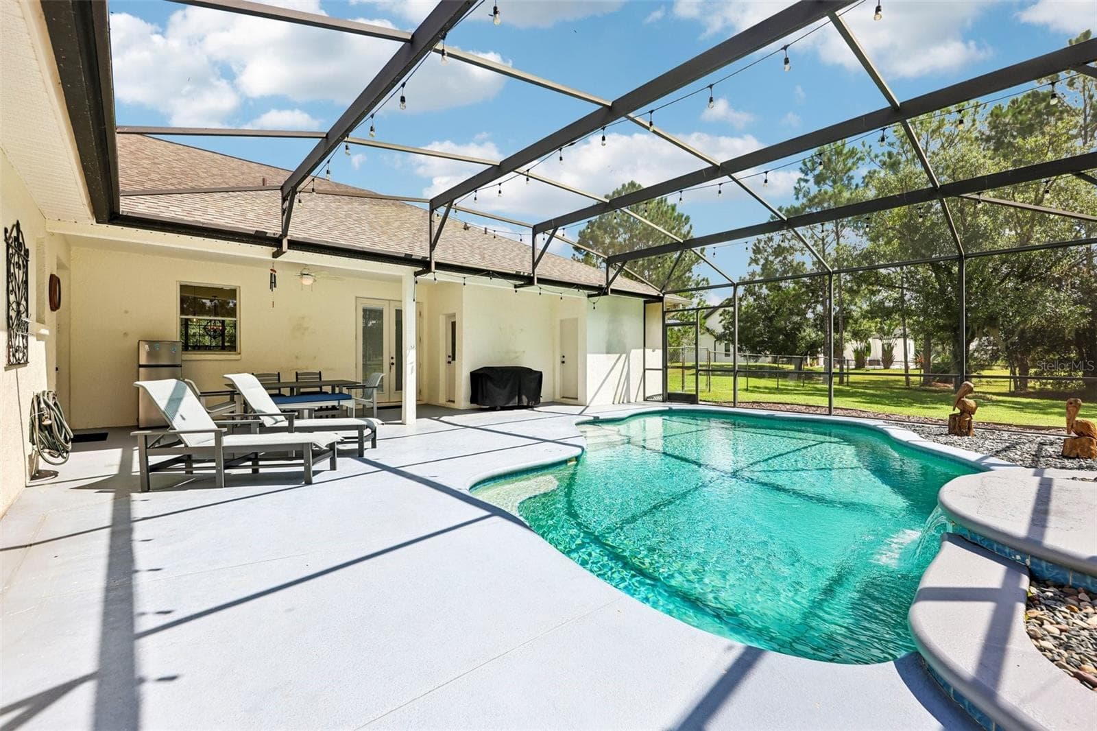 Your PRIVATE OUTDOOR RETREAT overlooks the expansive FENCED YARD and surrounding trees. - 19106 SHELDON ST, ORLANDO