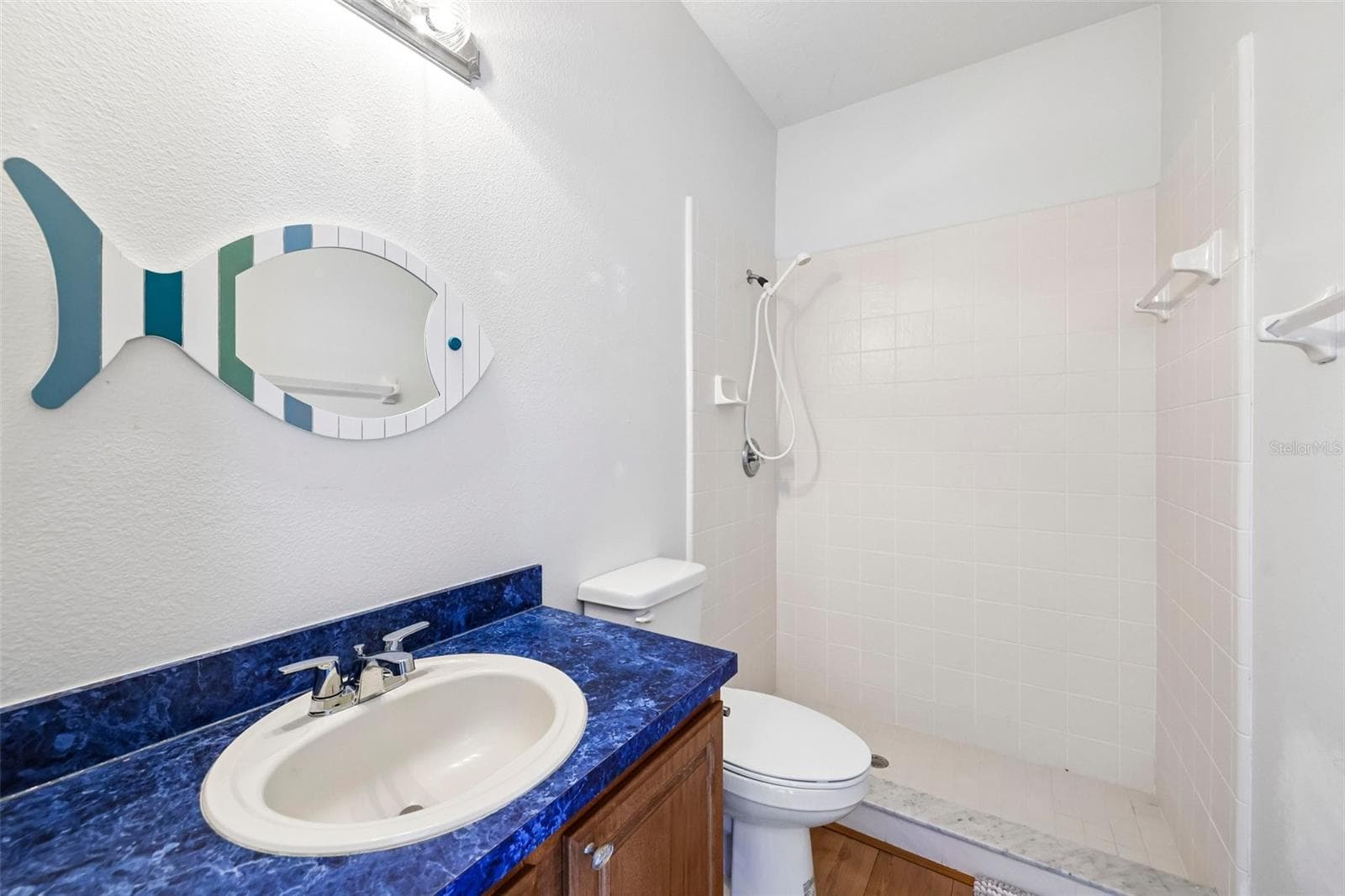 A third FULL BATH provides direct access to the pool area—perfect for guests and pool days. - 19106 SHELDON ST, ORLANDO