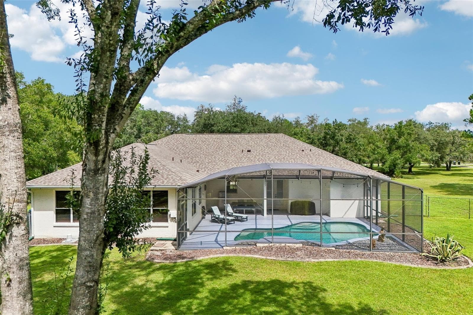 Major updates include a NEW ROOF (2025), NEW AC SYSTEMS (2025), NEW WELL PUMP (2025), WHOLE-HOME SURGE PROTECTOR (2025) and NEW WATER HEATER (2021), offering valuable peace of mind for the next owner. - 19106 SHELDON ST, ORLANDO