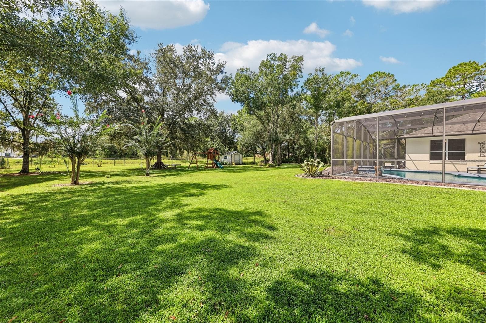 A peaceful setting surrounded by trees, this home offers the ROOM TO SPREAD OUT while still providing all the comforts you want. - 19106 SHELDON ST, ORLANDO