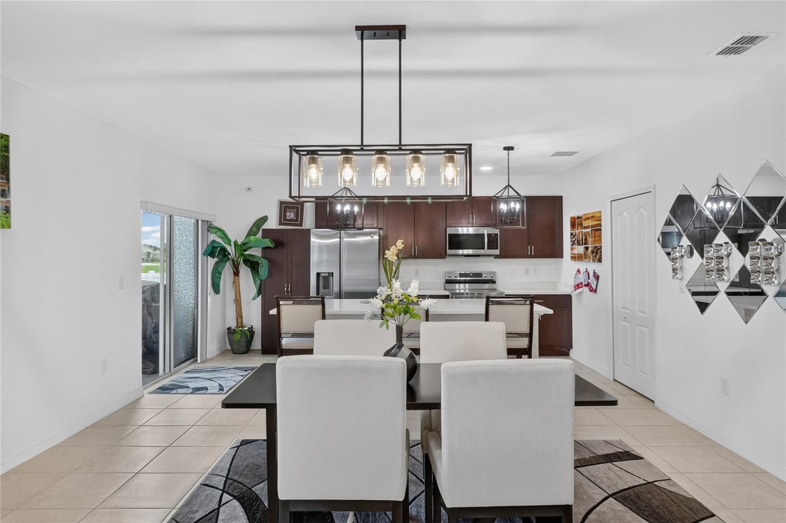 Looking from living room into dining room and kitchen. - 456 ADRIEL AVE, WINTER HAVEN