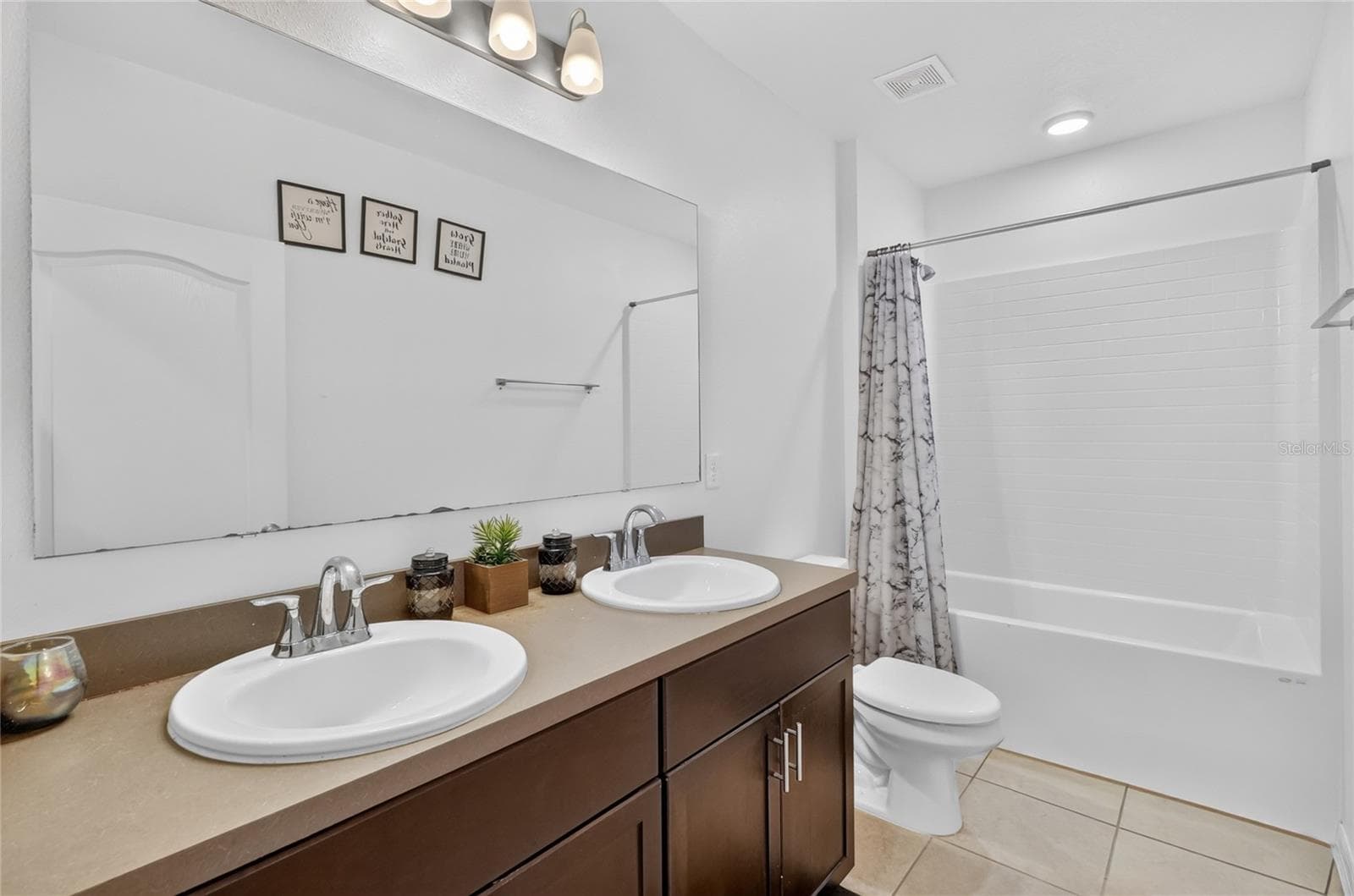 Guest bathroom with dual sinks - 456 ADRIEL AVE, WINTER HAVEN