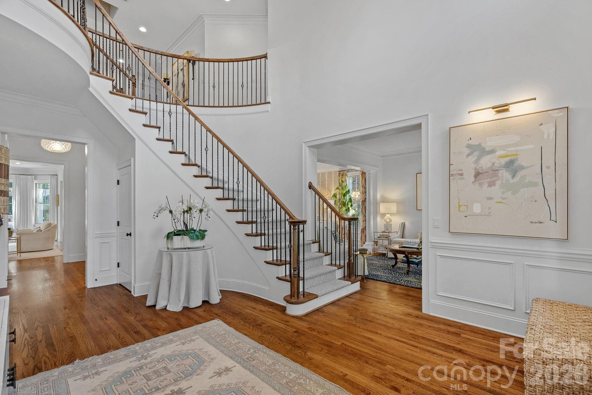 Beautiful curved staircase and two story foyer welcomes you at the front door. - 1104 Longwood Court, Matthews