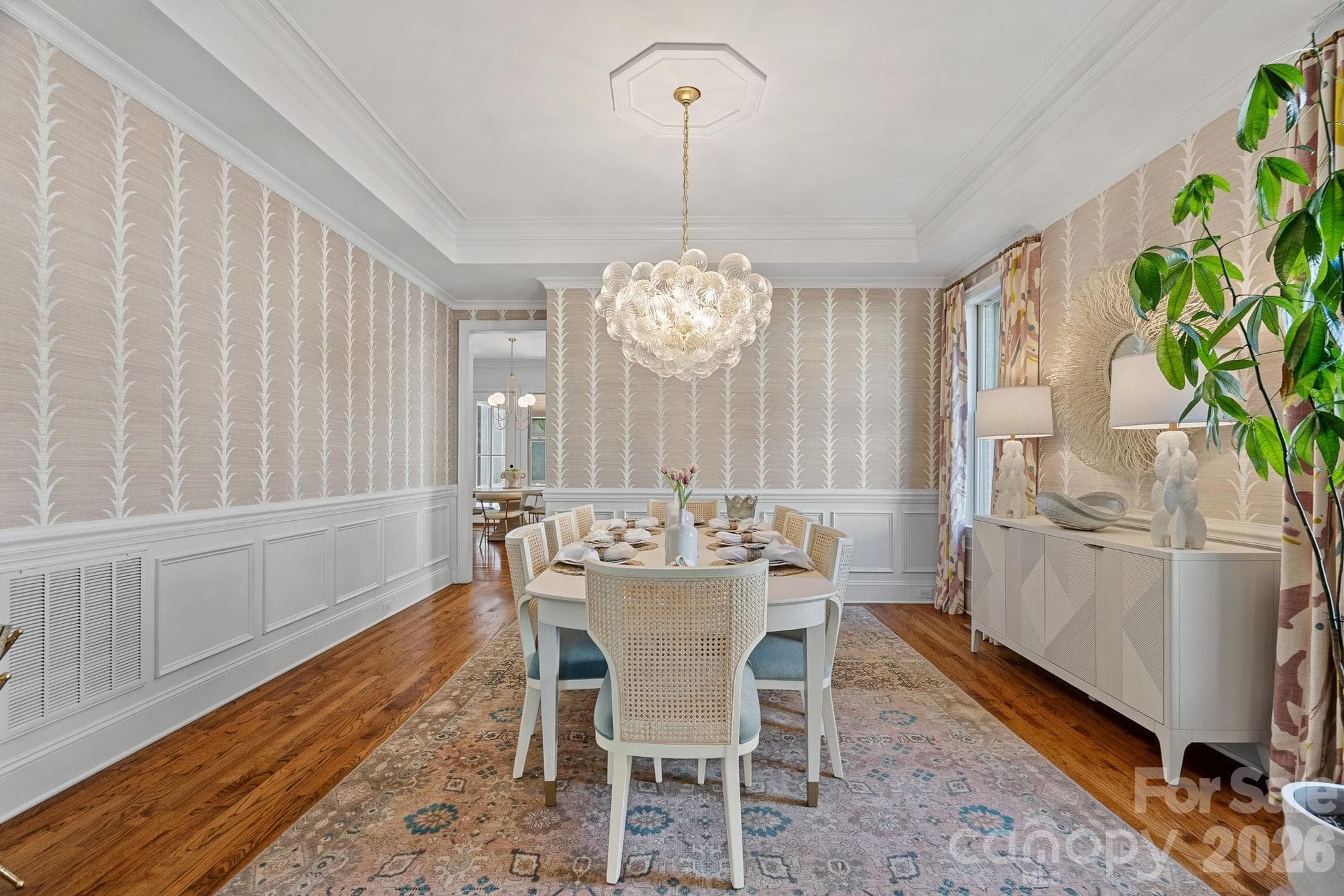 Formal Dining Room is just beyond the living room and has a pass through into the kitchen. - 1104 Longwood Court, Matthews
