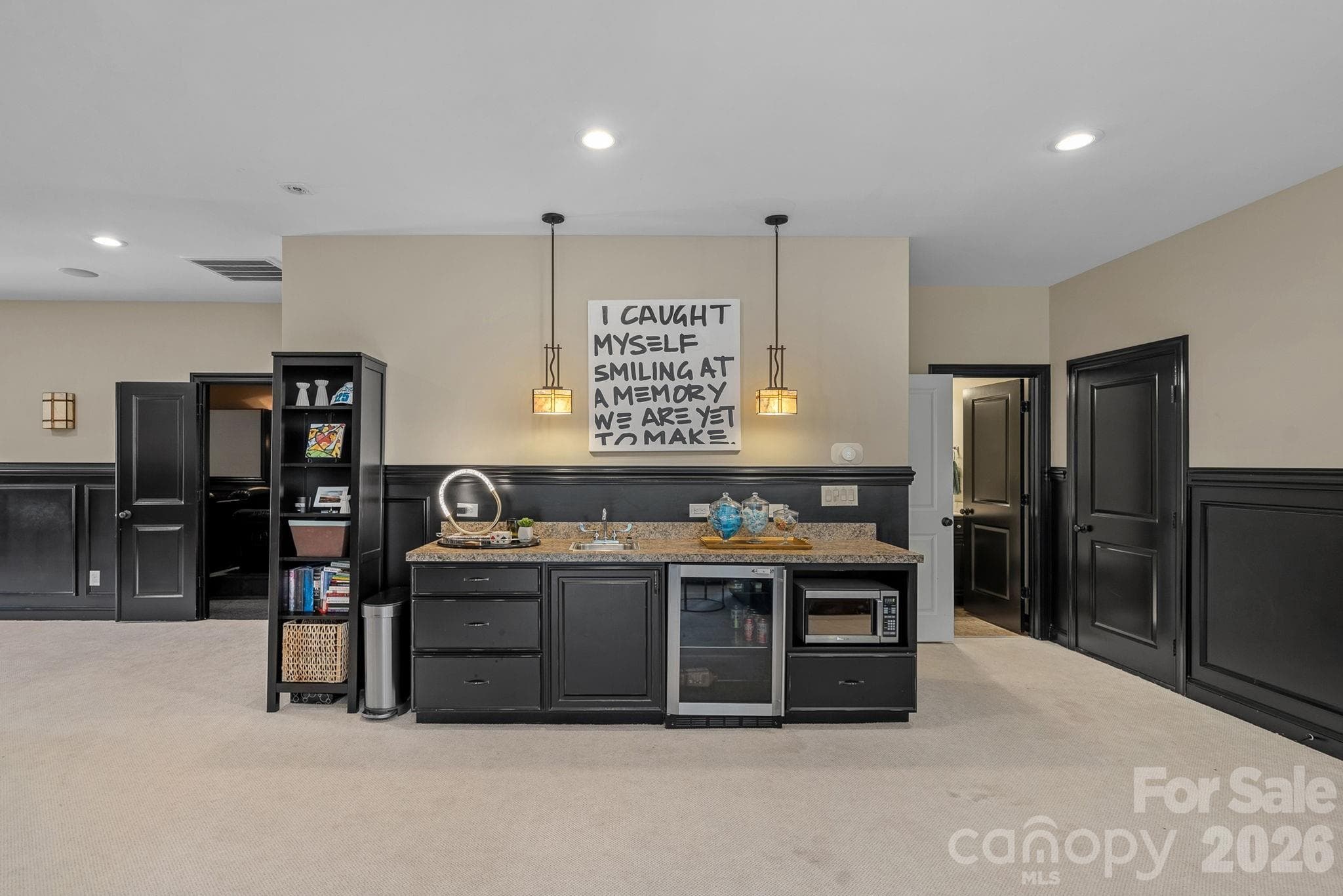 Third floor bonus room with bar, custom paneling and plenty of space to play. - 1104 Longwood Court, Matthews