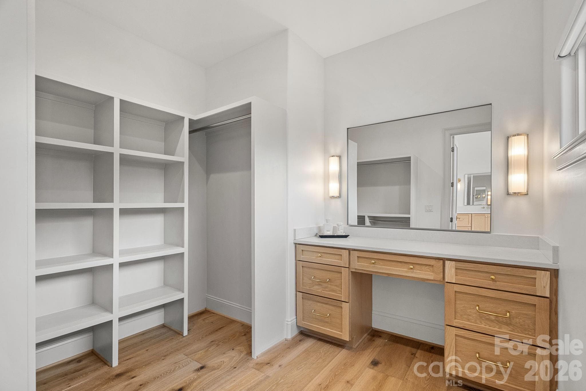 1 of 2 primary closets upstairs, the second closet has washer / dryer hook up - 7679 Rabbit Circle, Denver