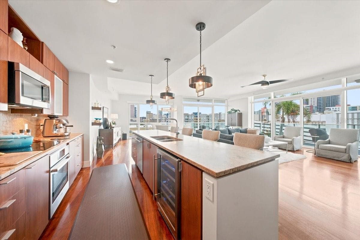 Spacious kitchen features granite countertops, stainless steel appliances, and abundant cabinetry. - 111 N 12TH ST #1704, TAMPA