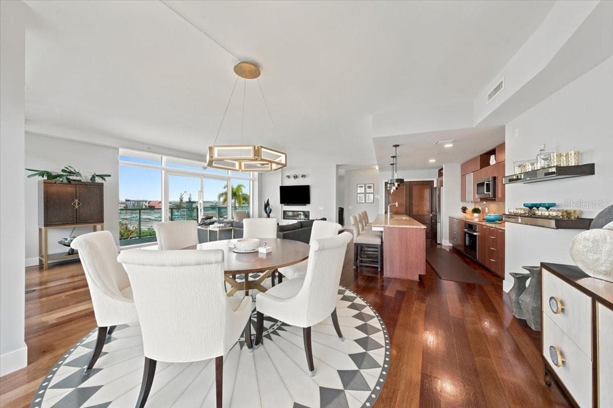 Multiple gathering spaces create a layout with the scale and versatility of a single-family home. - 111 N 12TH ST #1704, TAMPA
