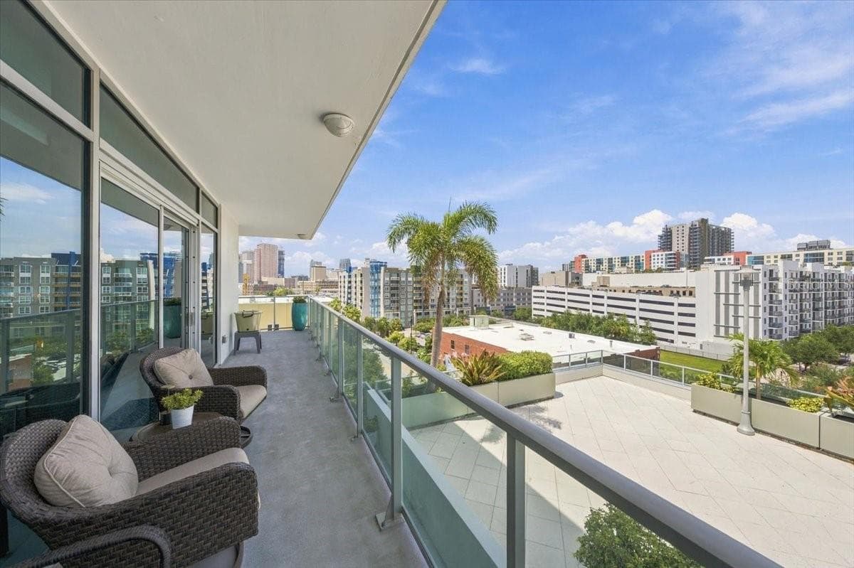 Multiple living areas connect naturally to the expansive terrace. - 111 N 12TH ST #1704, TAMPA