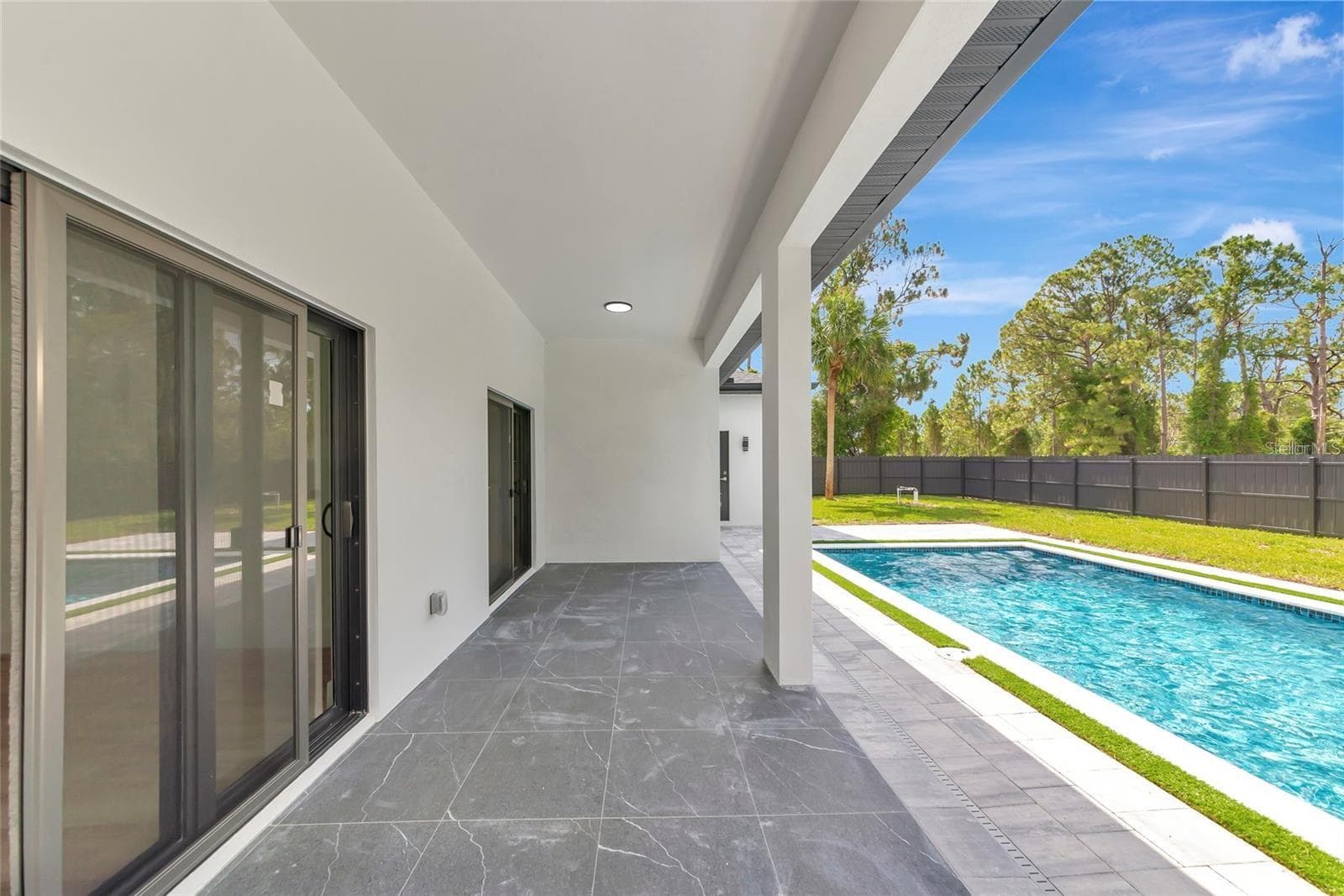 Virutally Staged with a Pool - 7511 BLUTTER RD, NORTH PORT