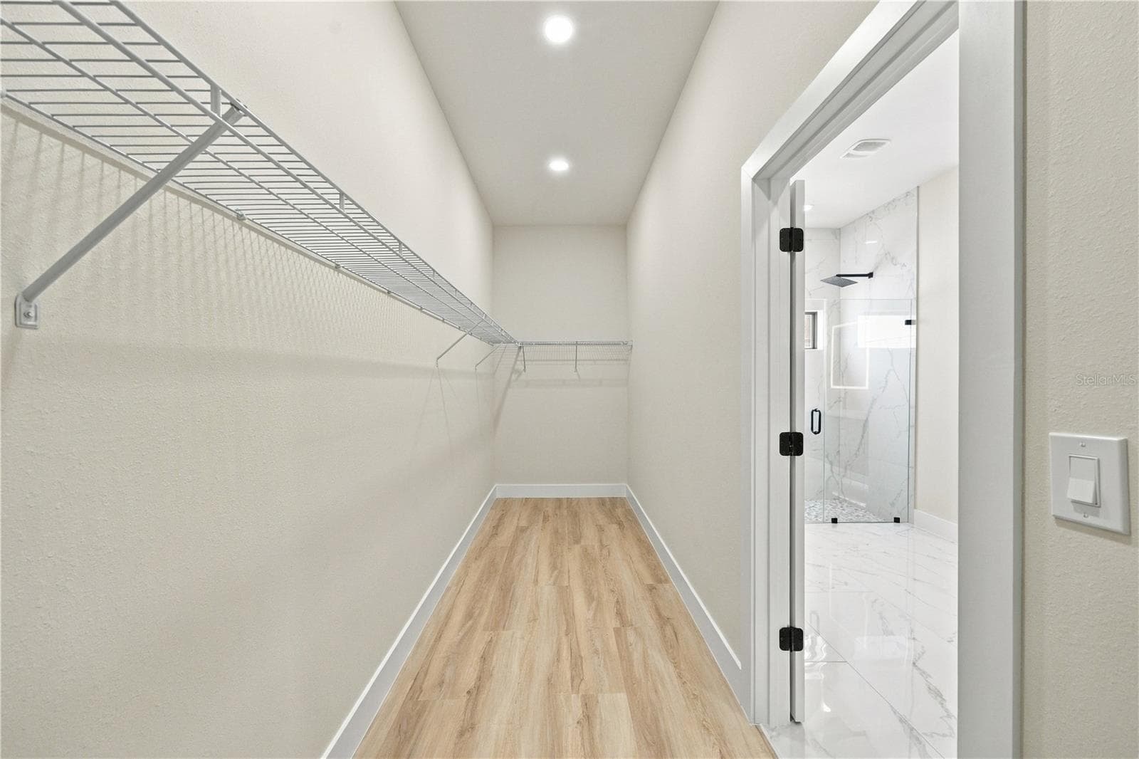 Primary Bedroom Walk-in Closet - 7511 BLUTTER RD, NORTH PORT