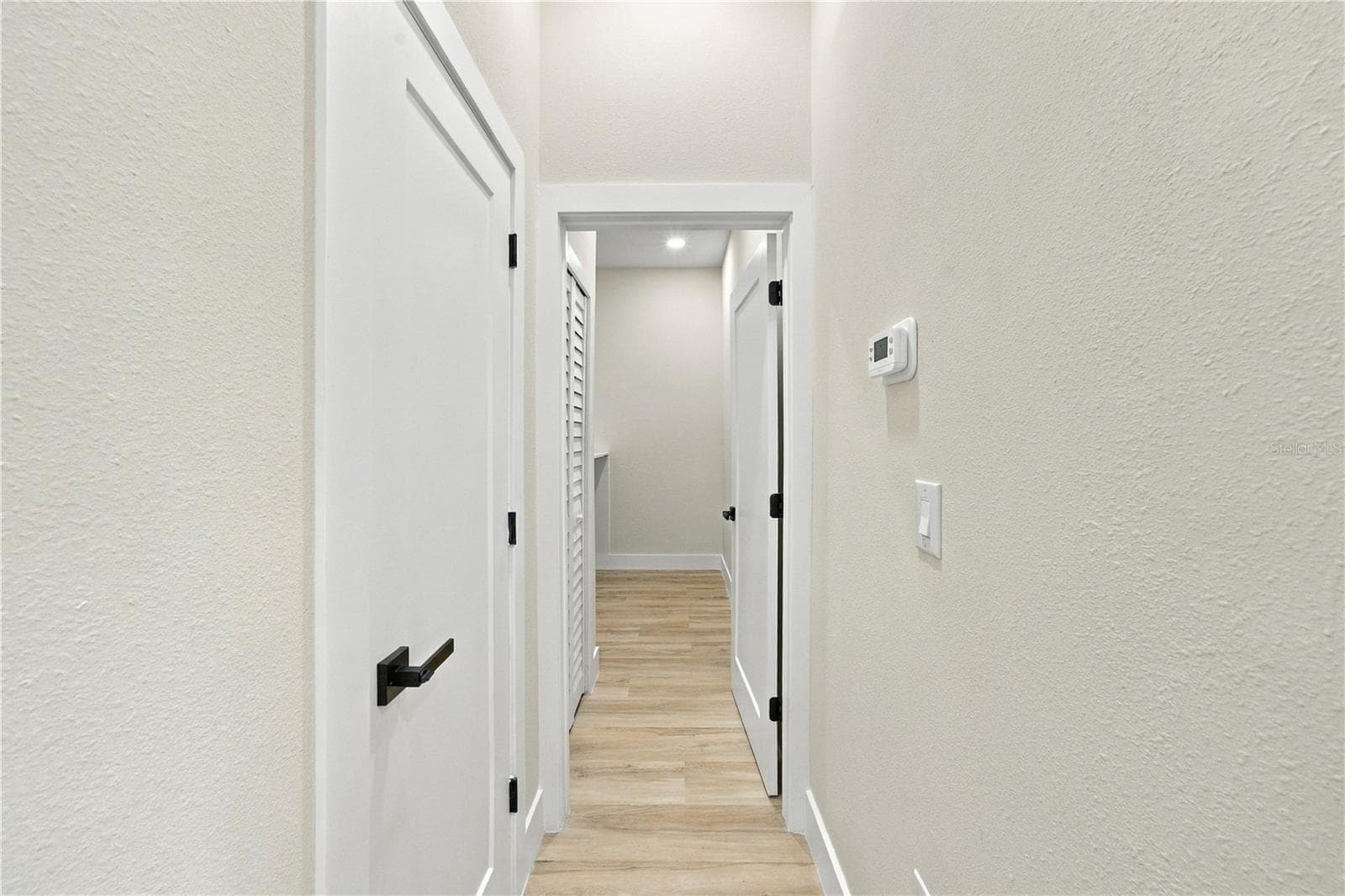 Pantry and Hallway to Laundry Room - 7511 BLUTTER RD, NORTH PORT