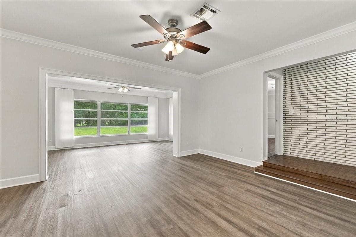 Living Room Looking to Sunroom - 950 14TH ST NE, WINTER HAVEN