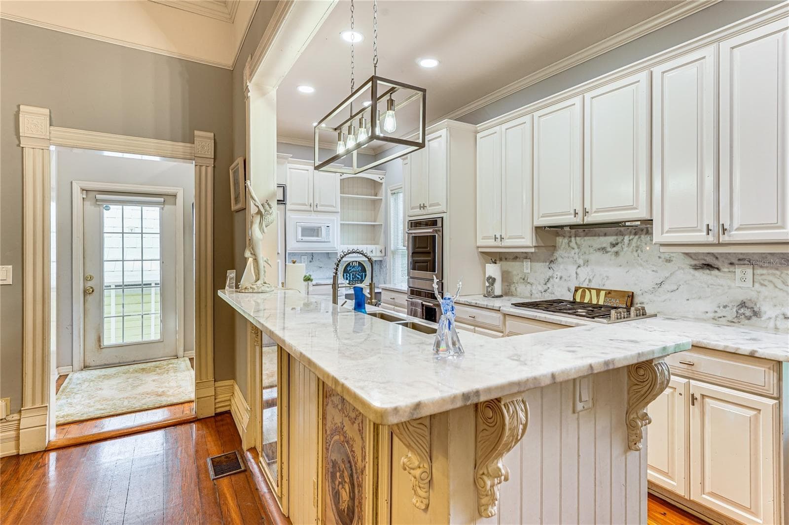 Updated Kitchen with Large Granite Island - 743 E FORT KING ST, OCALA