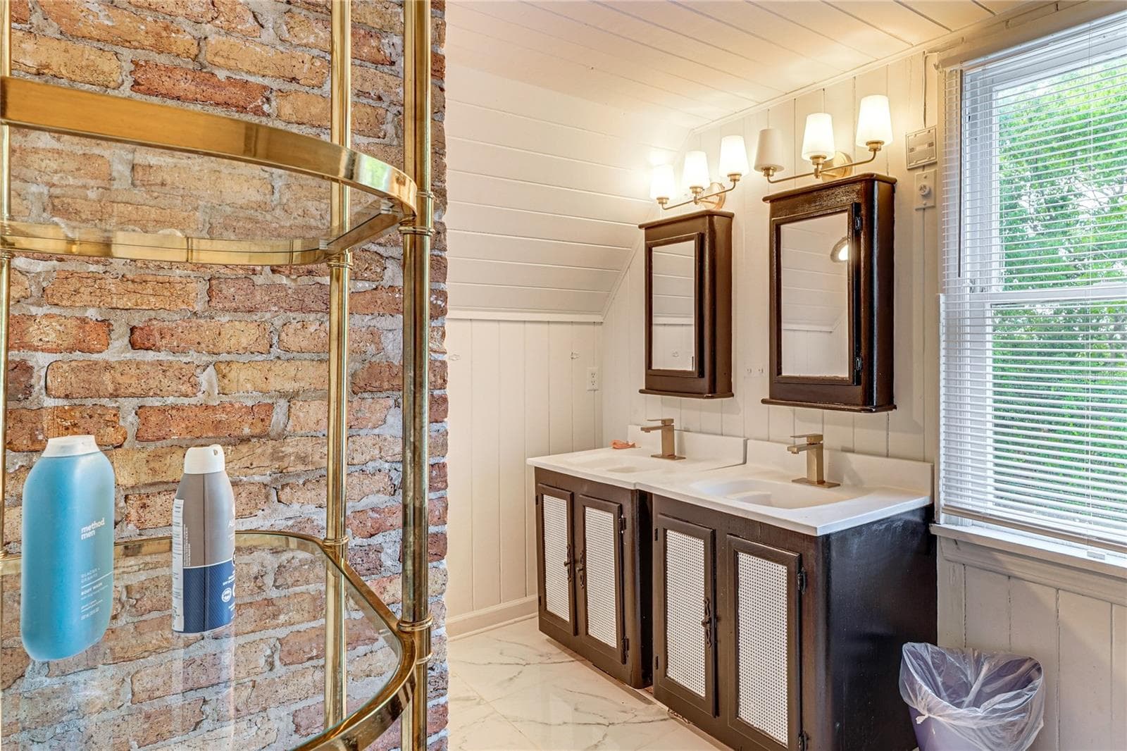 Bathroom with Double Vanity and Exposed Brick - 743 E FORT KING ST, OCALA
