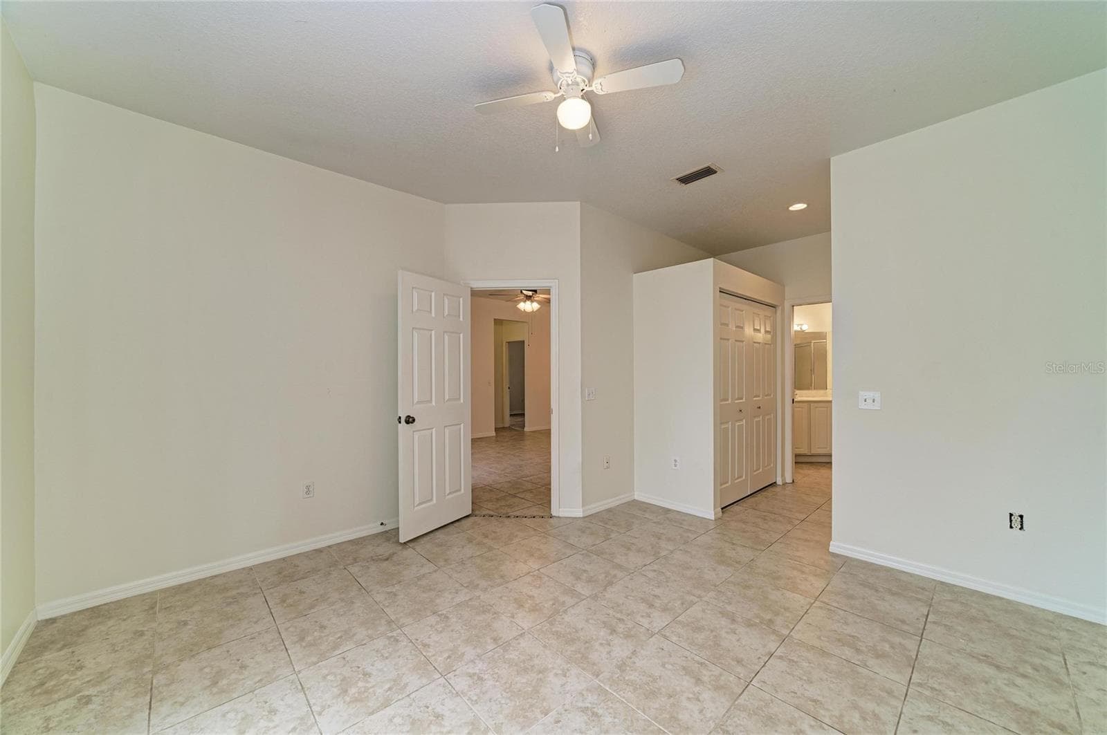 Primary bedroom facing en suite - 1101 CANE MILL LN, BRADENTON