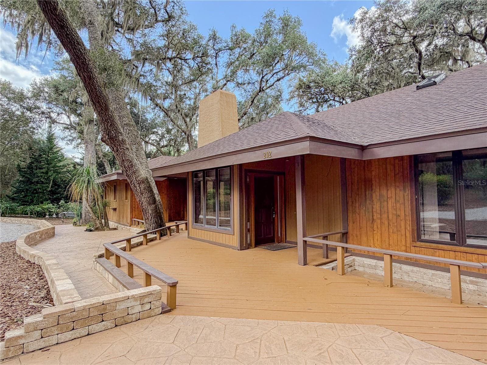 Custom decking and pavers start at the front door! - 202 MASON RD, MELROSE