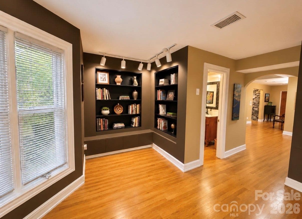 Library and half bath at entrance to den area. - 4821 Elmhurst Drive NE, Hickory