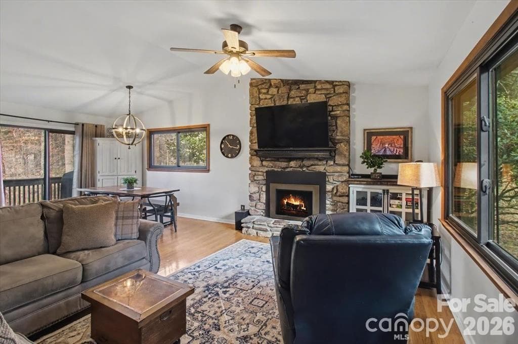 Living Room filled with natural light and gas fireplace - 30 Whippoorwill Drive, Weaverville