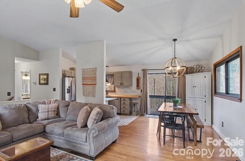 Living room flows nicely into the dining area and kitchen - 30 Whippoorwill Drive, Weaverville