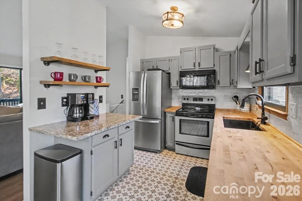 Updated kitchen with stainless steel appliances and Butcher Block Countertops. - 30 Whippoorwill Drive, Weaverville