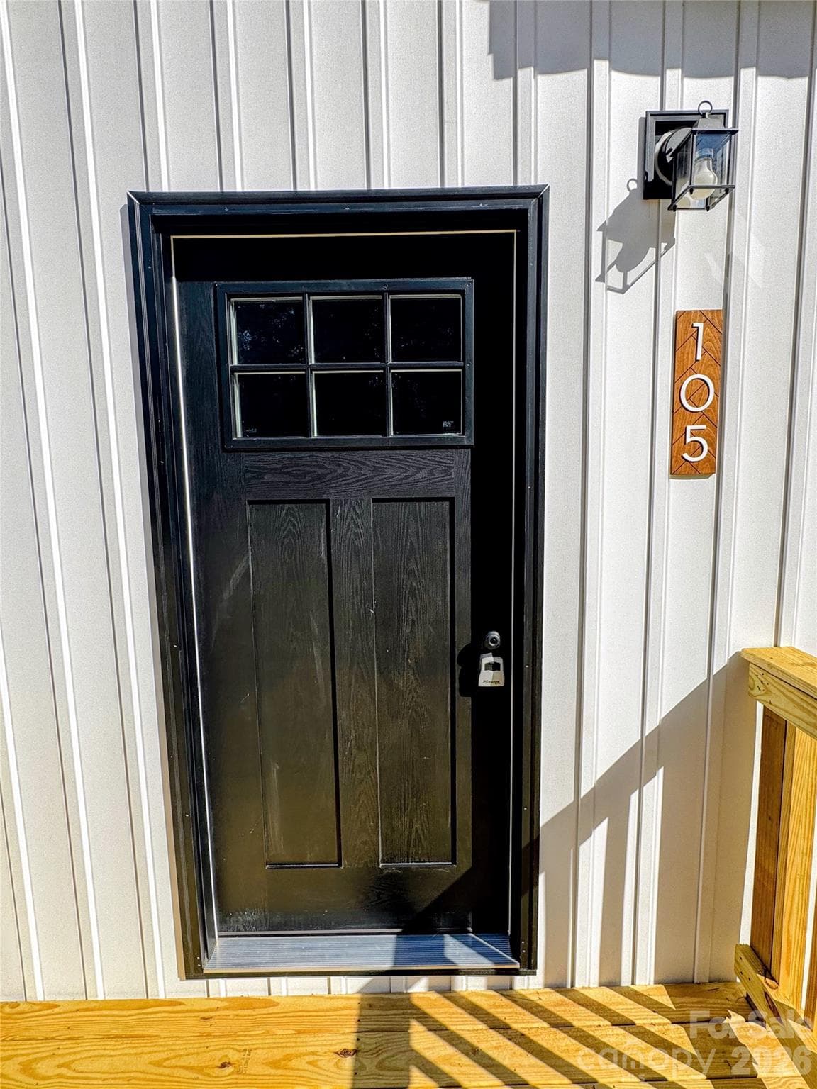 front exterior with vertical siding - 105 Cottontail Lane, Statesville