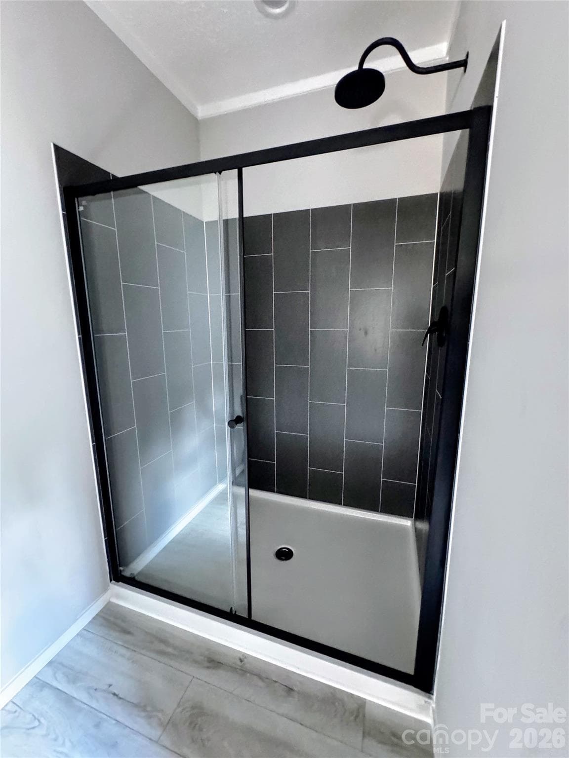 primary bathroom tiled shower panels & rain shower head - 105 Cottontail Lane, Statesville