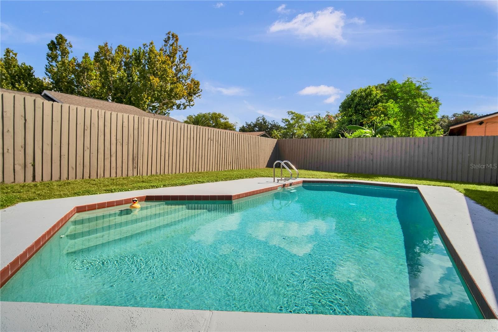 Enjoy Florida living with a fenced backyard and in-ground pool - 2311 TOWERBRIDGE ST, ORLANDO