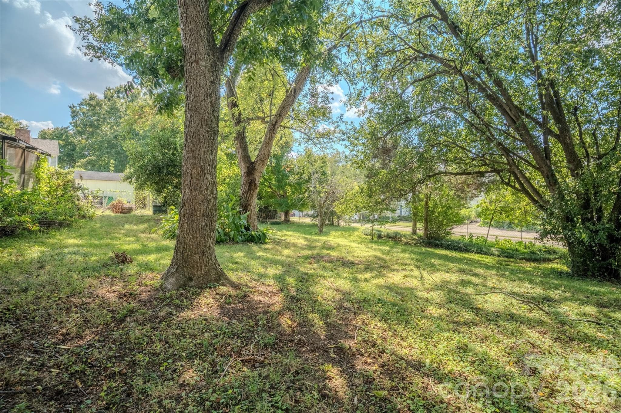 Fully fenced backyard with terraced garden beds - 6516 Brynwood Drive, Charlotte