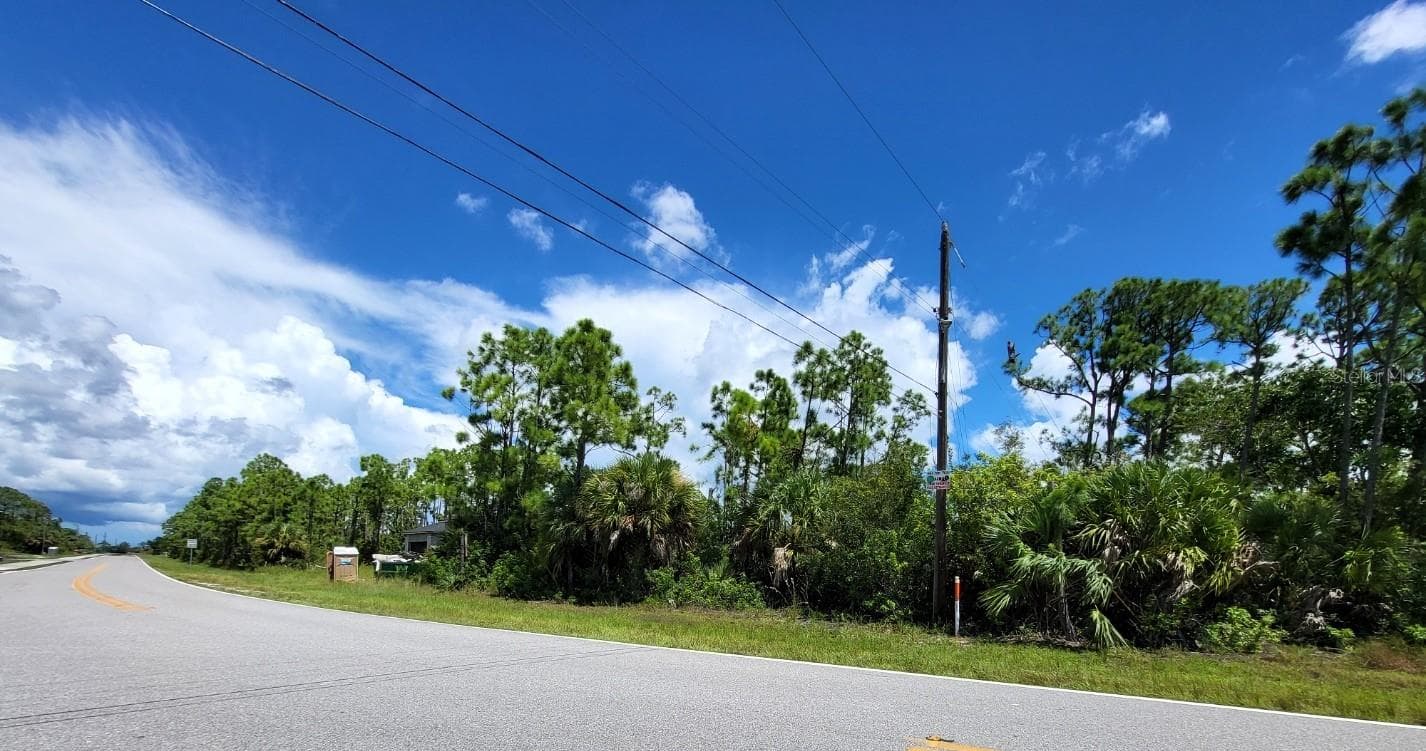 Looking North. Home under construction on adjacent lot. - 9500 HALLENDALE DR, PORT CHARLOTTE